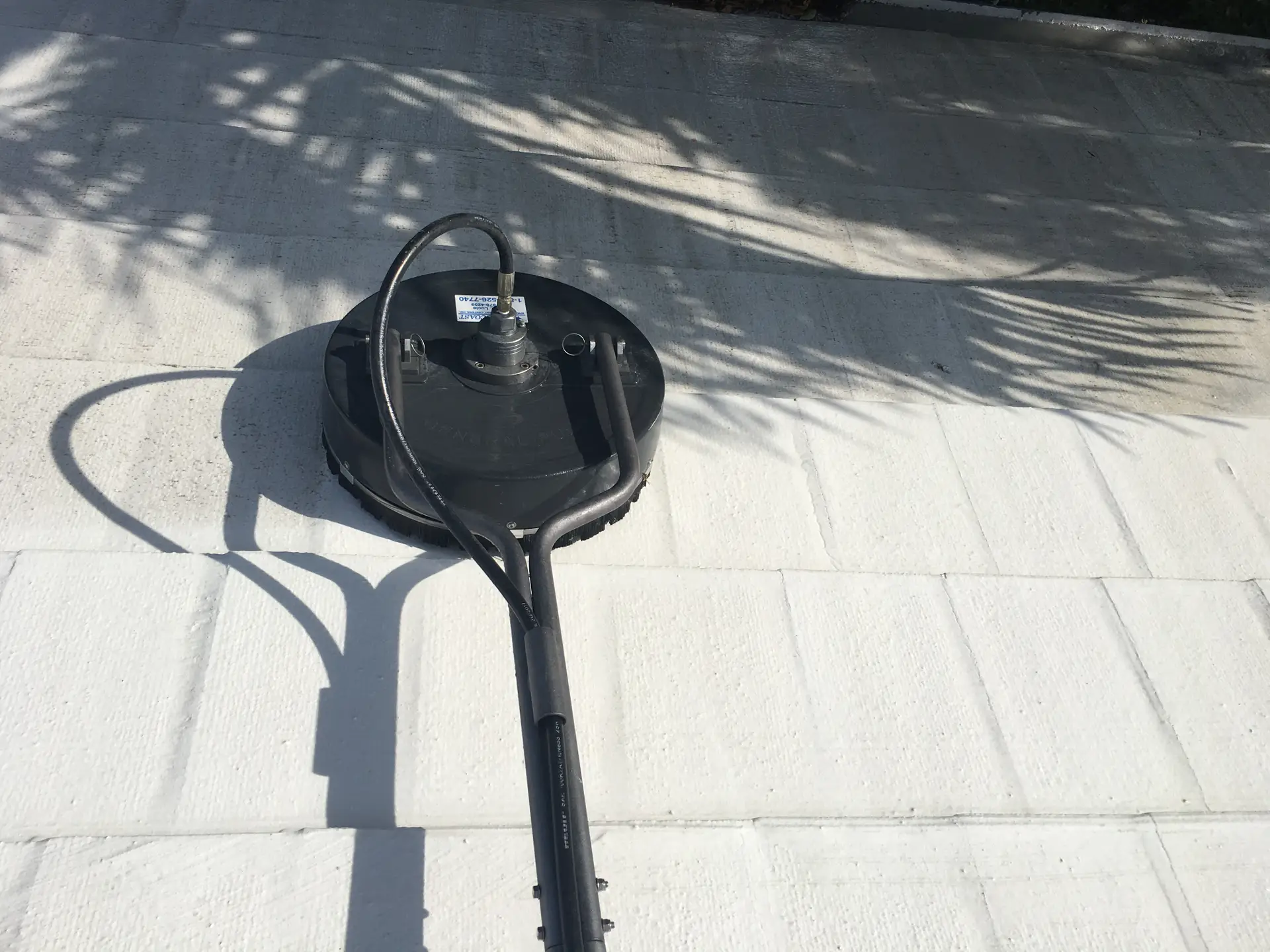 Soft wash cleaning tool applied to tile roof surface — Smart Shield | The Roof Store Soft wash cleaning tool applied to tile roof surface