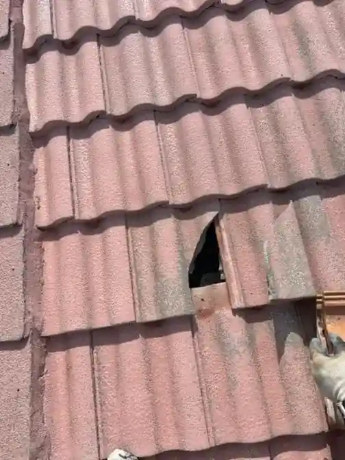 Broken roof tile before Smart Shield repair — open valley damage — Smart Shield | The Roof Store Broken roof tile before Smart Shield repair — open valley damage