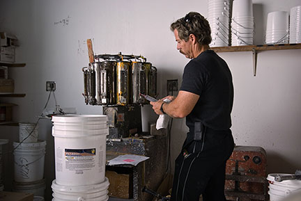 Liquid rubber roof coating filling station at The Roof Store factory — Davie, FL